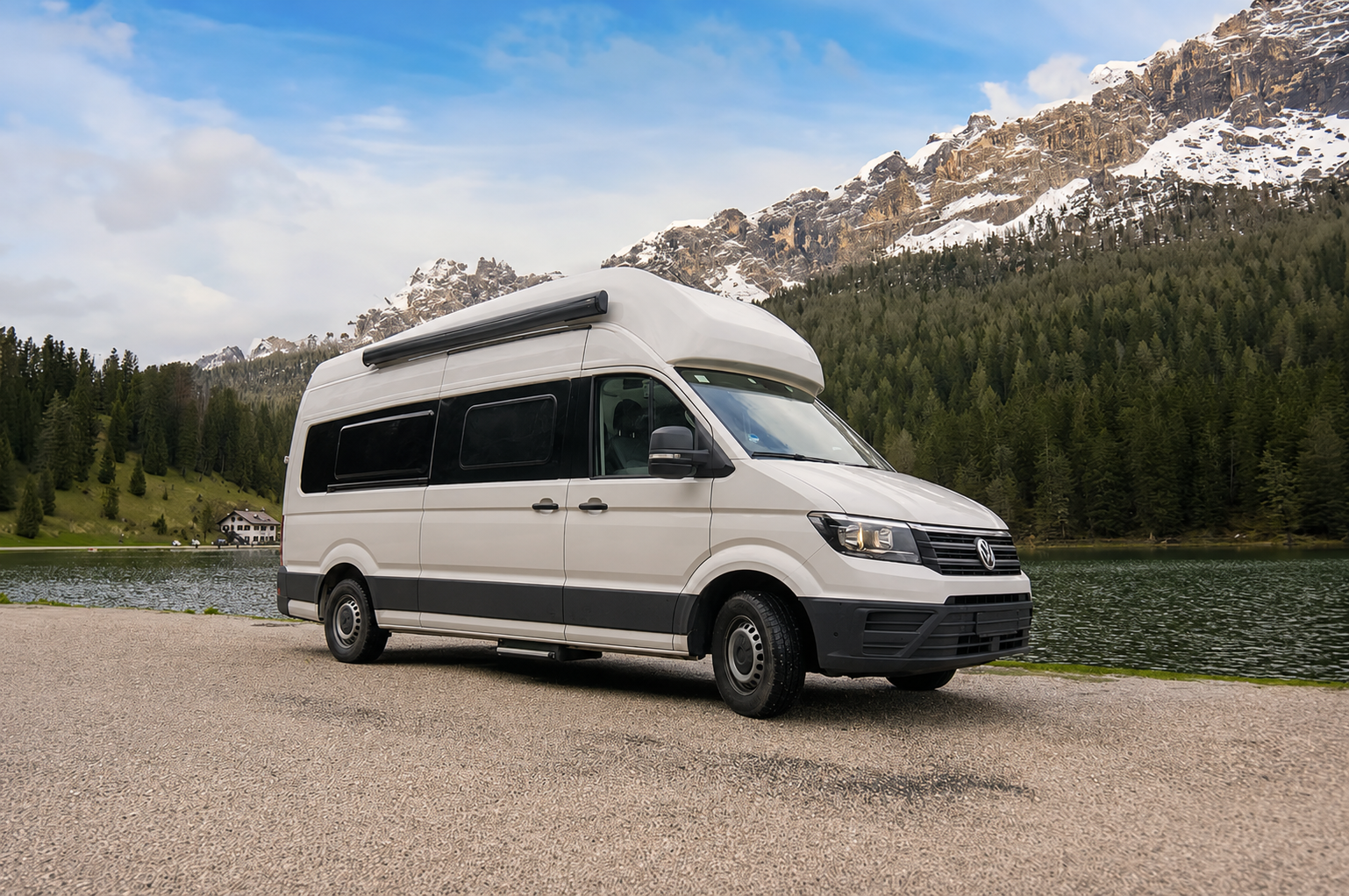 Large white camper van, side and front view, high roof, long wheelbase, no roof tent visible.
