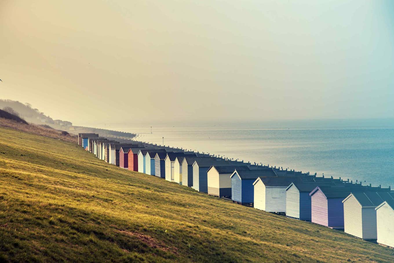 Multiple colourful houses near the ocean