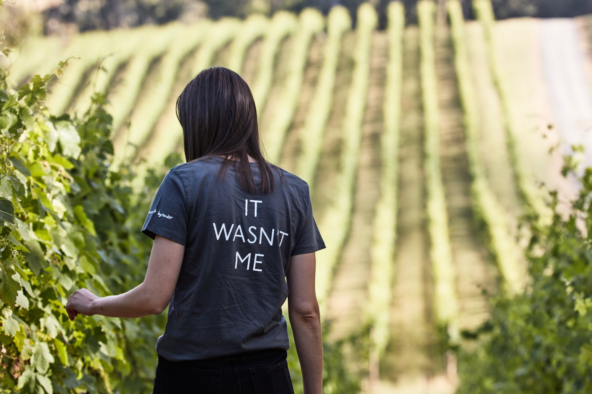 Girl walking through a vineyard in the Yarra Valley