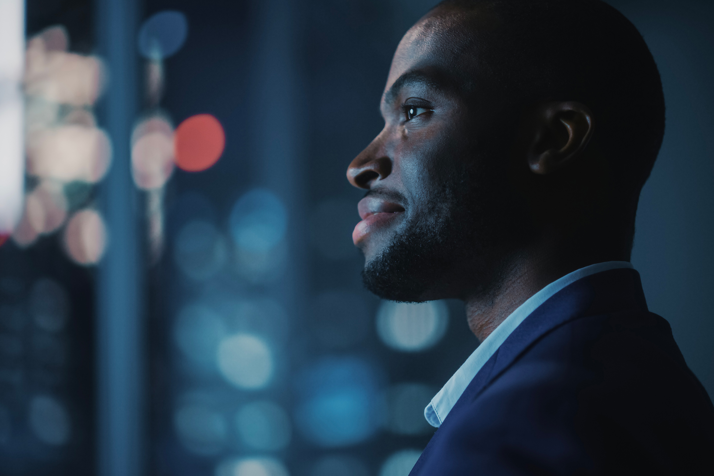 Person observing digital information in a modern tech setting