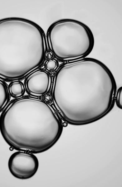 Close-up of metallic spheres in a connected pattern, symbolizing advanced materials and industrial innovation.