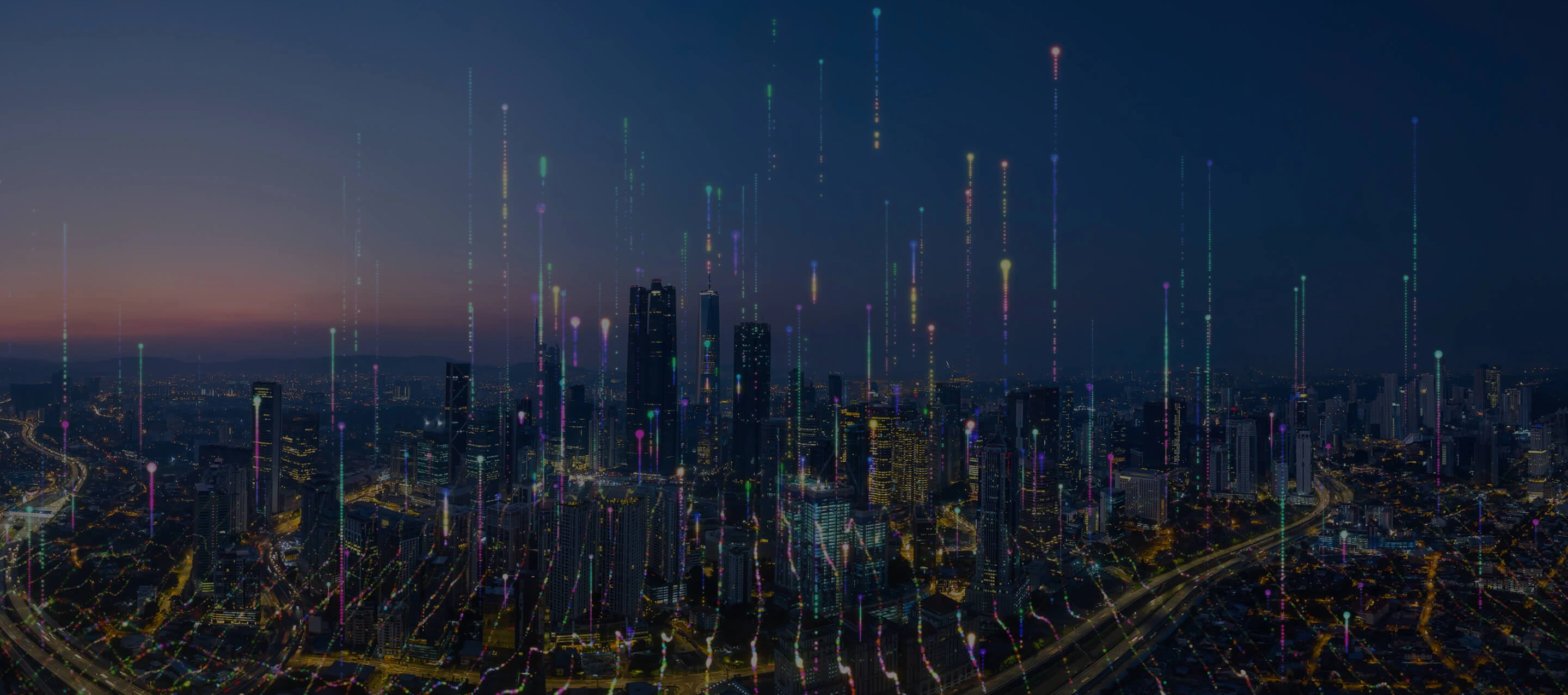 A futuristic nighttime city skyline with colorful vertical light trails rising above the buildings, symbolizing digital connectivity and data flow.