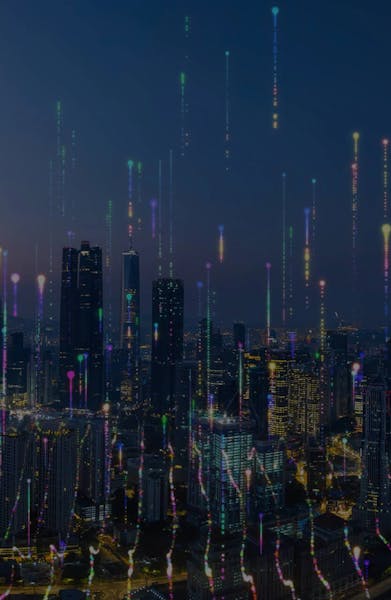 A futuristic nighttime city skyline with colorful vertical light trails rising above the buildings, symbolizing digital connectivity and data flow.