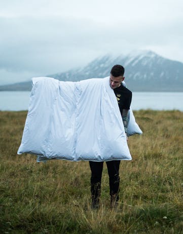 Arni Orvarsson with an eiderdown duvet from icelandiceider.com, Image: Joe Shutter