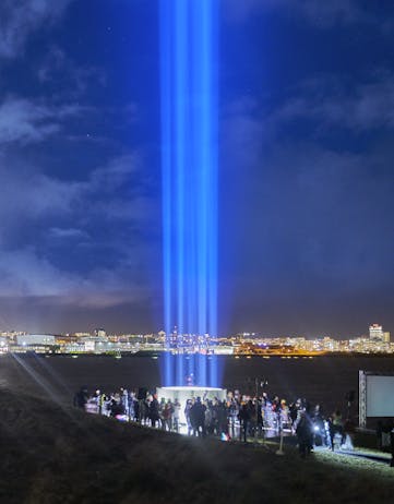 The annual lighting of the Imagine Peace Tower on Viðey Island in Reykjavík, Iceland.