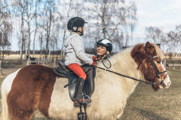 Girl horseback riding on Icelandic horse