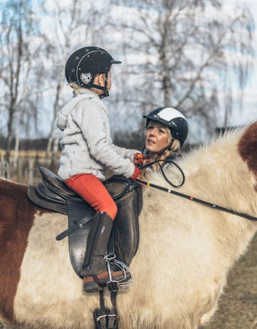 Girl horseback riding on Icelandic horse