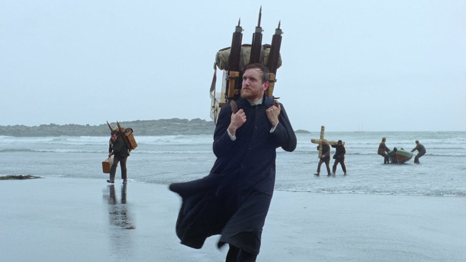 A still from Godland of Danish priest Lucas (Elliott Crosset Hove) on Iceland's shores. Photo: Maria von Hausswollf