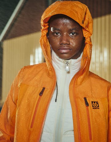 Woman in an orange 66°North jacket