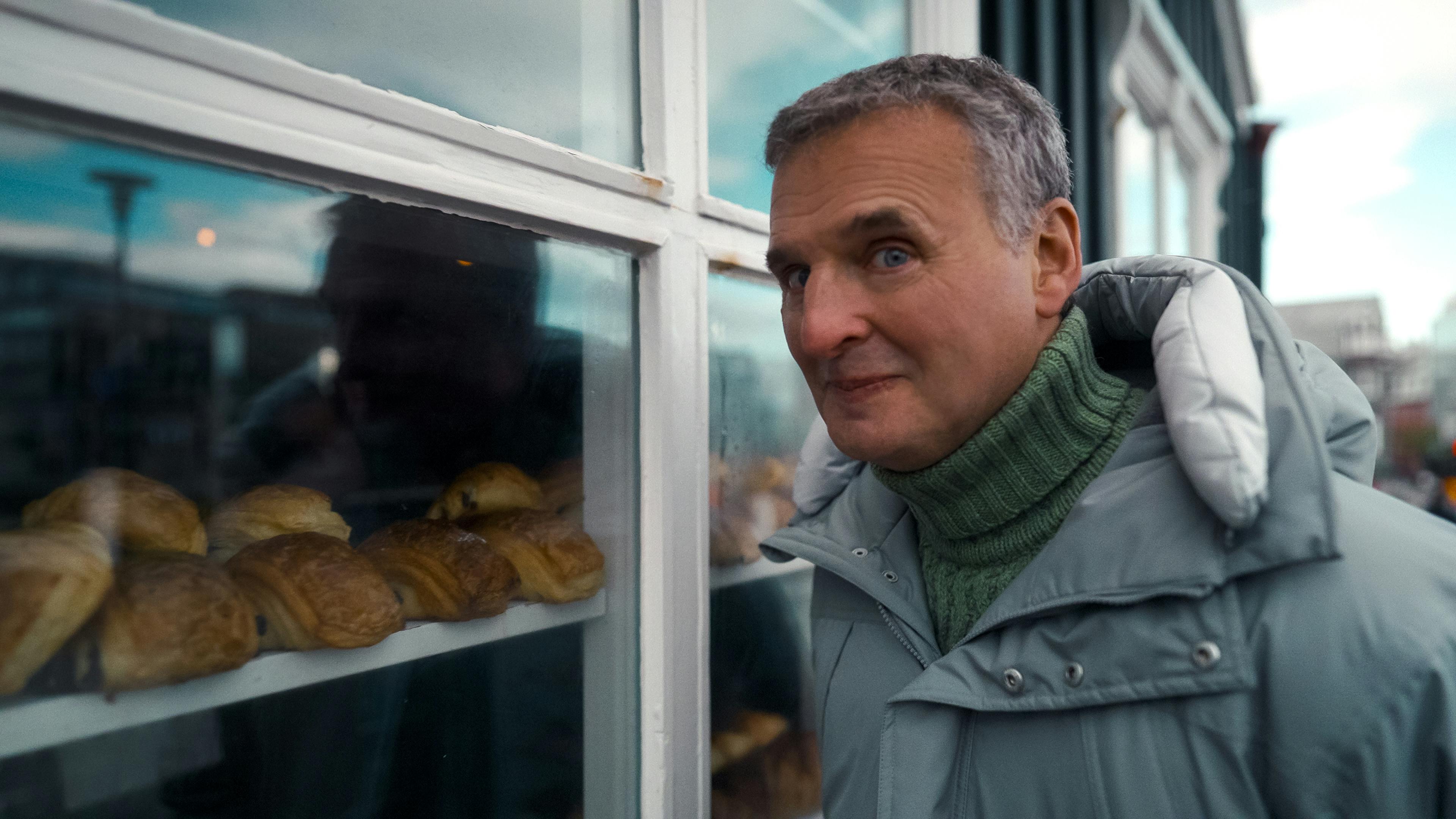 Philip Rosenthal of "Somebody Feed Phil" looking through the bakery window of Brauð & Co. in Reykjavík, Iceland. 