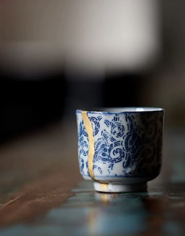 Kintsugi: Japanese Repair Technique image of a broken porcelain cup for DesignMarch 2024.