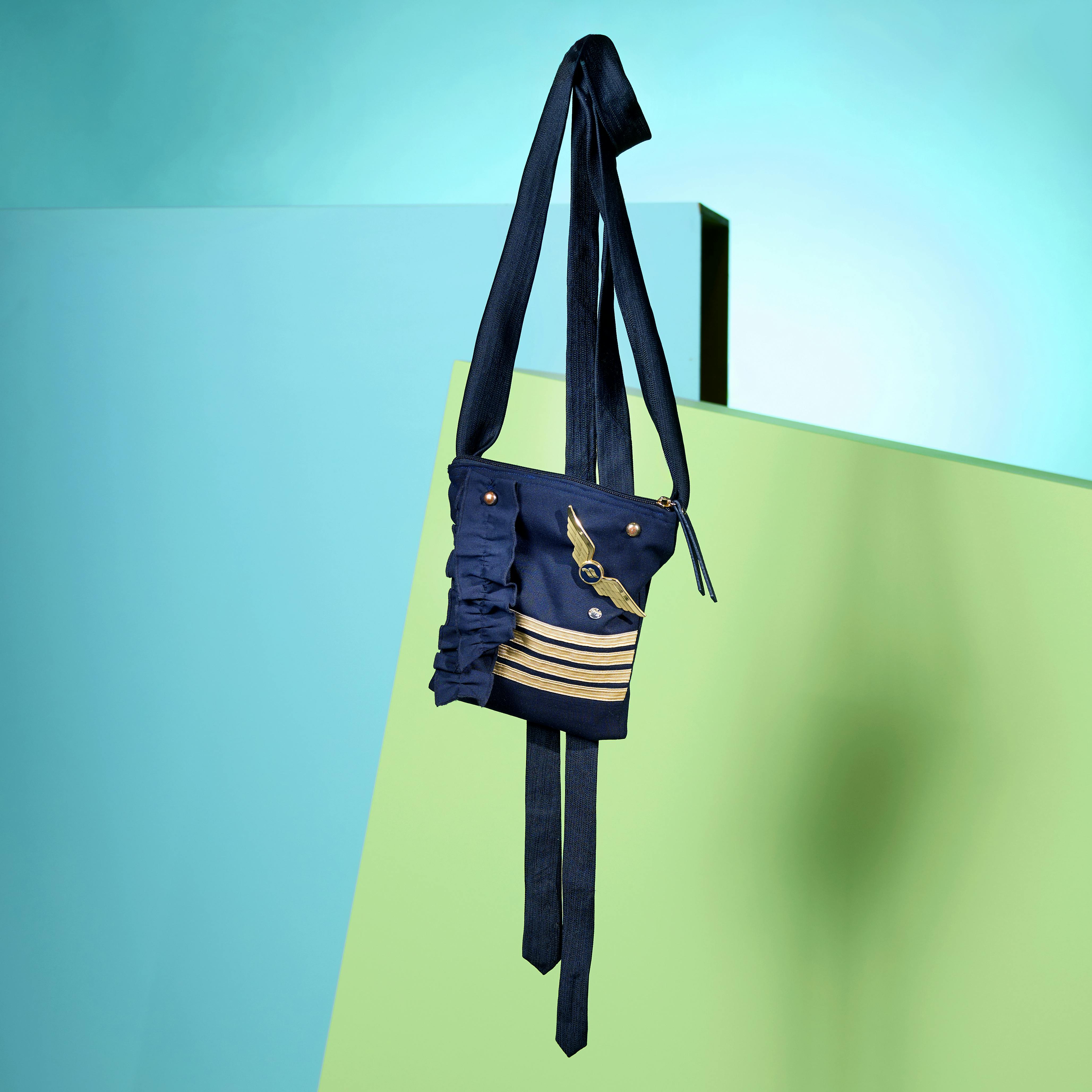A bag made from Studio Flétta made from recycled Icelandair flight uniforms.