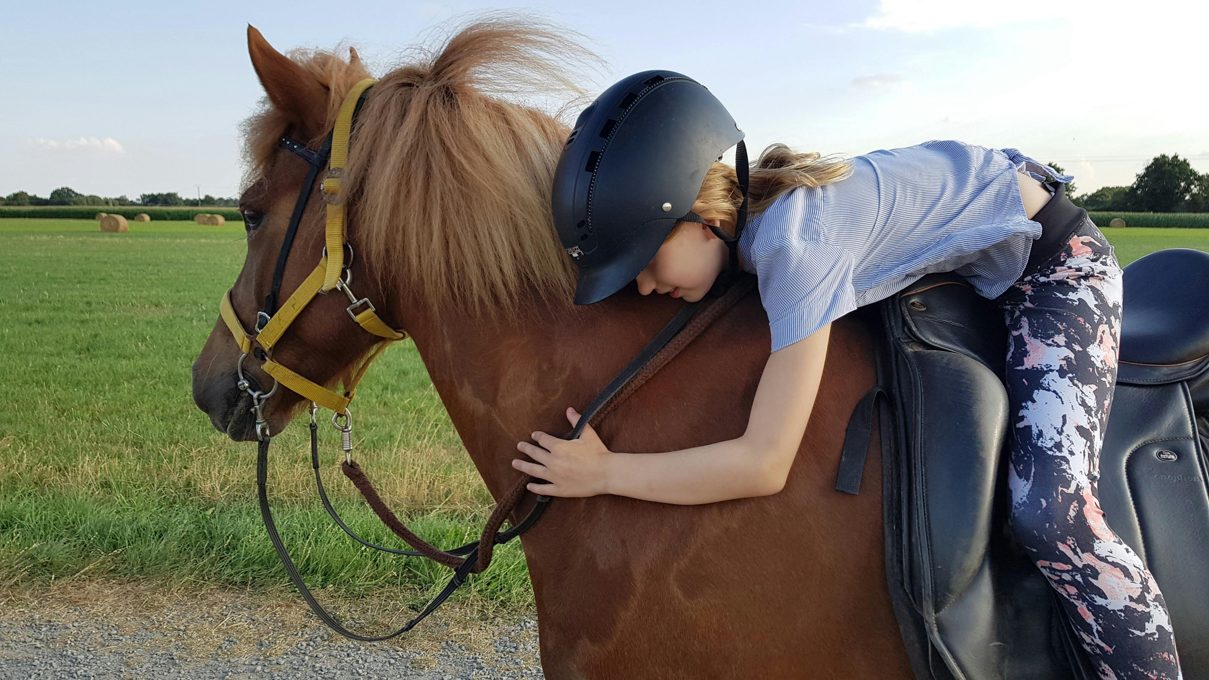 Girl horseback riding on an Icelandic horse