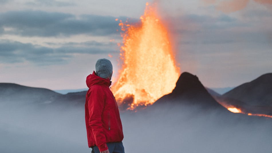 Traveler enjoying the eruption at Geldingadalir