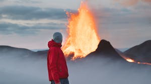 Traveller enjoying the eruption at Geldingadalir