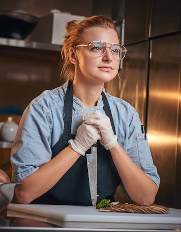 A woman chef holding a knife