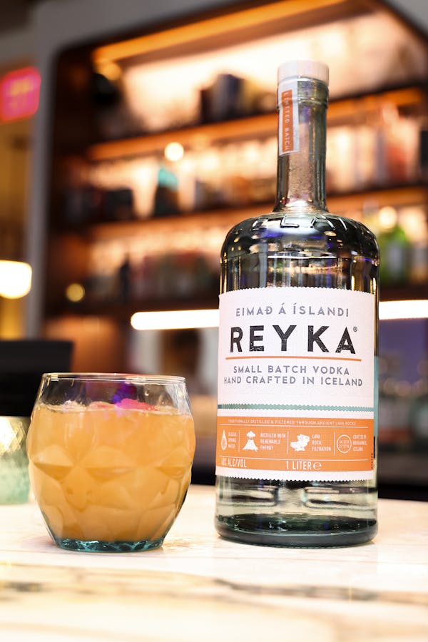Close up of Reyka Vodka bottle and cocktail