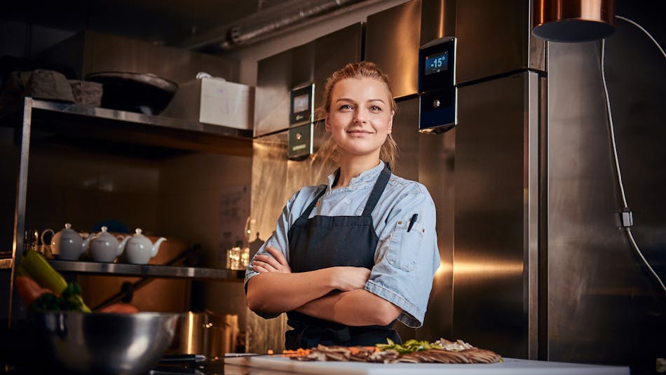 Woman chef in kitchen