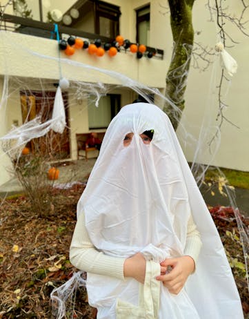 A child dressed up as a ghost for Halloween in Iceland. 