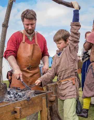 A young blacksmith apprentice at the Hafnarfjörður Viking Festival.
