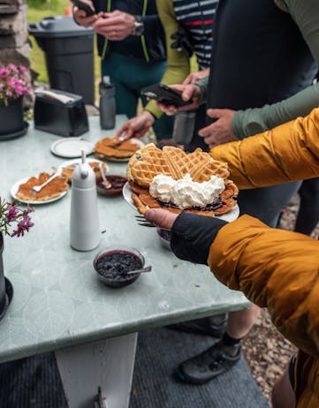 Cyclists stopping for a waffle break during the Arna Westfjords Way Challenge.