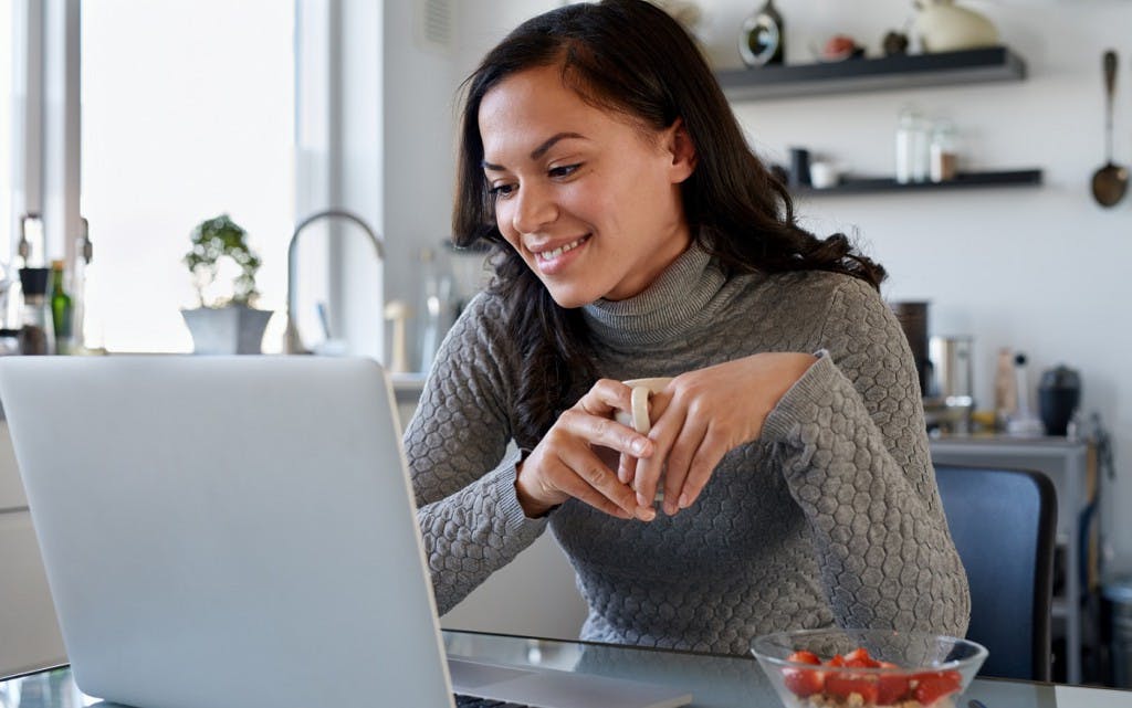 Woman at home using a laptop