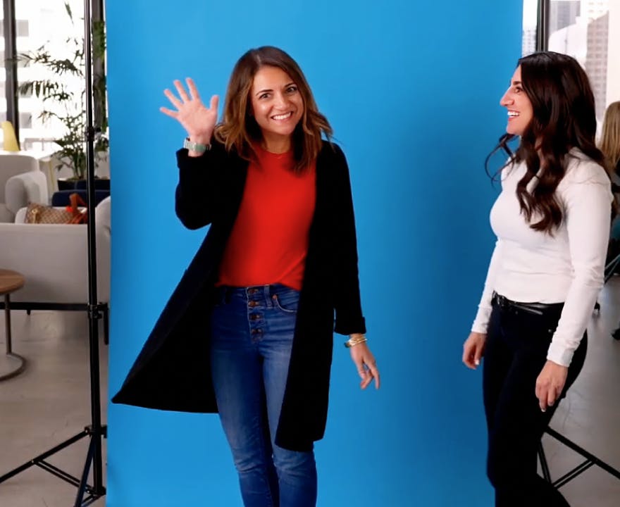InStride employee waving to the camera