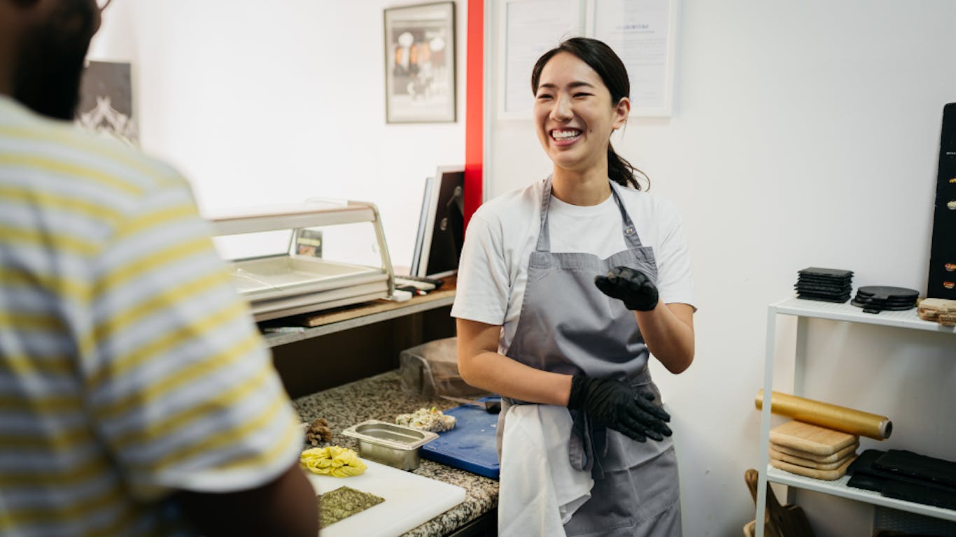 woman smiling at work in a restaurant