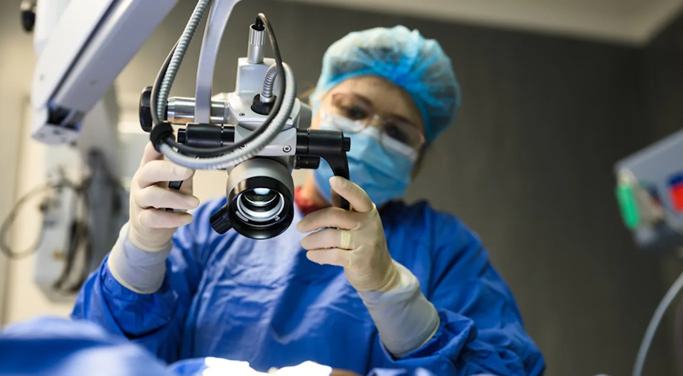 woman in a lab using a camera
