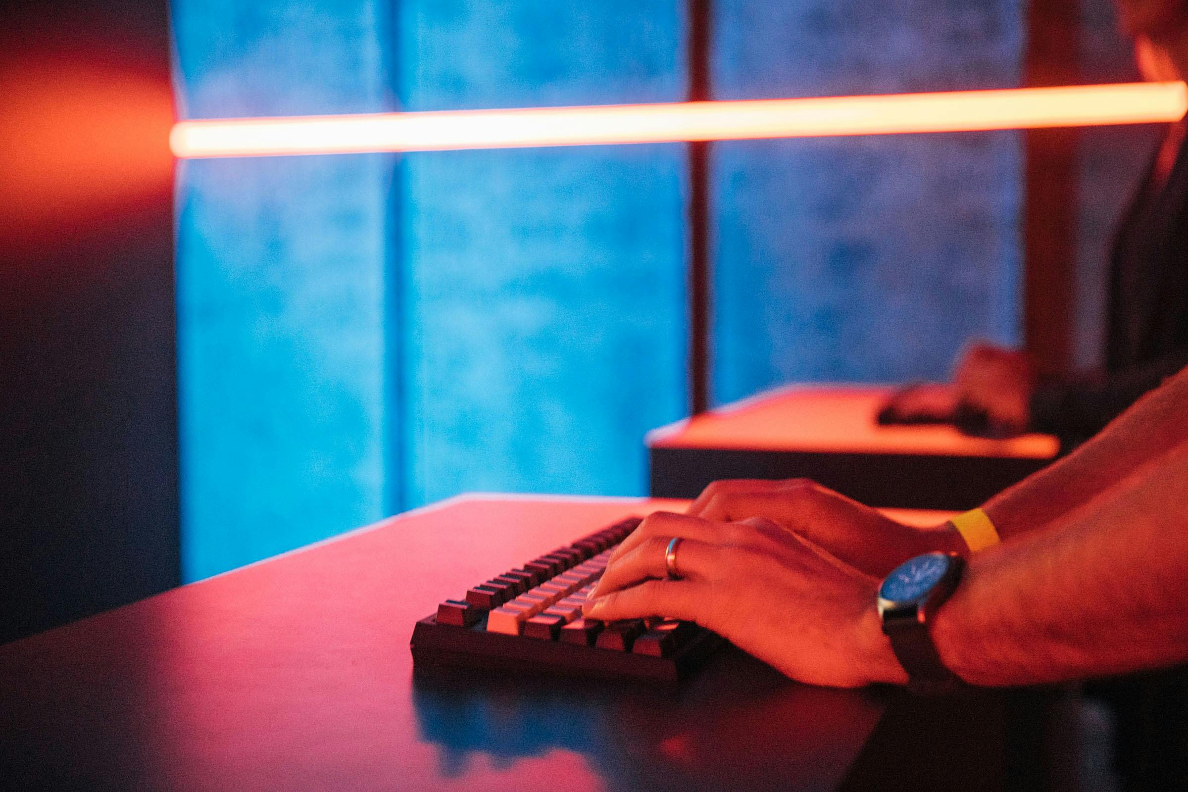 A closeup of a man's hands on the Query It! keyboard.