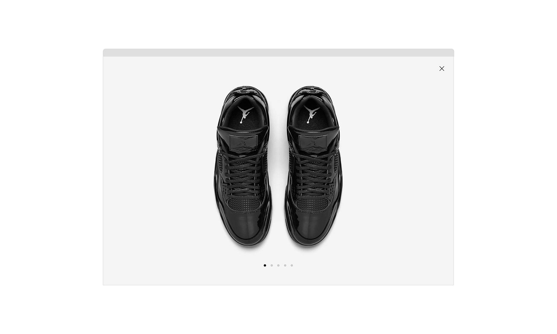A carousel of images takes over the screen to showcase the details of the featured black sneakers.