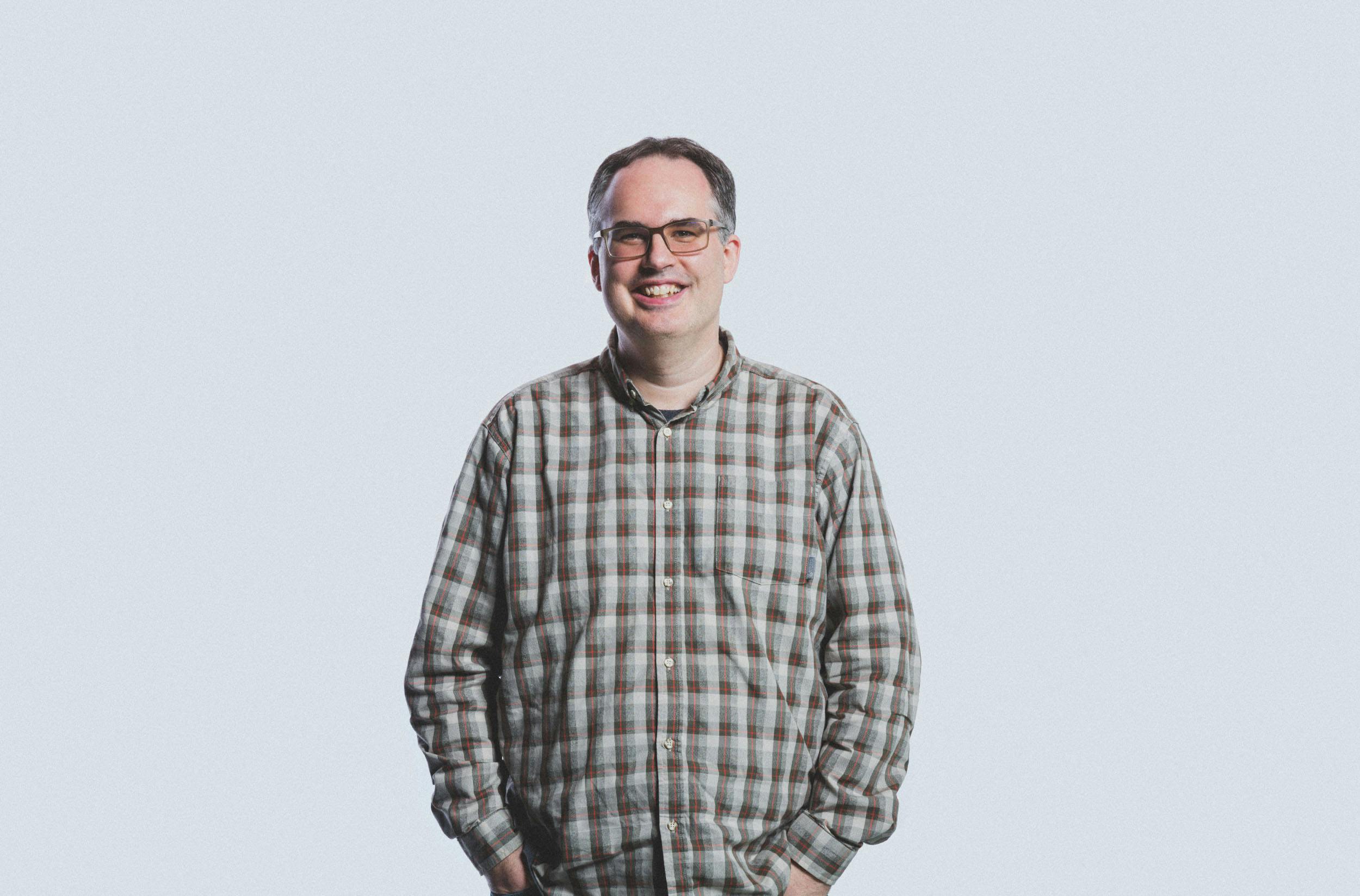 A headshot of David Brewer