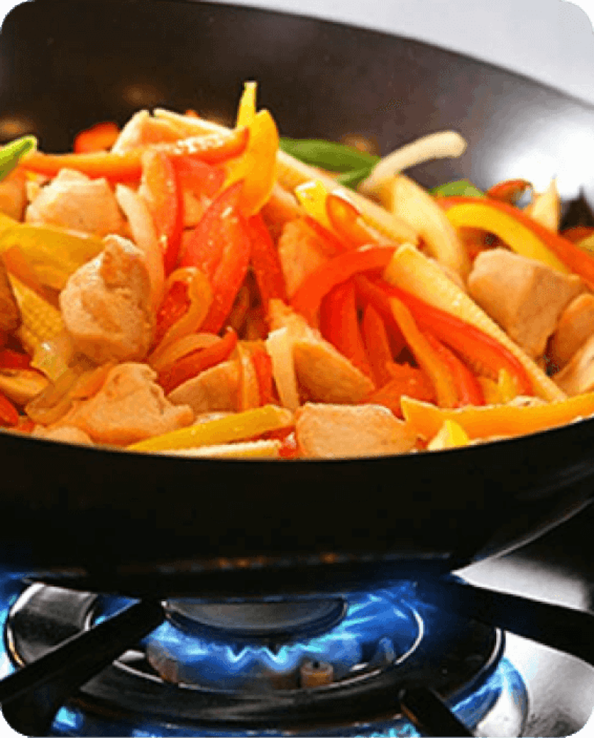 picture of a diced vegetables inside a frying pan on fire