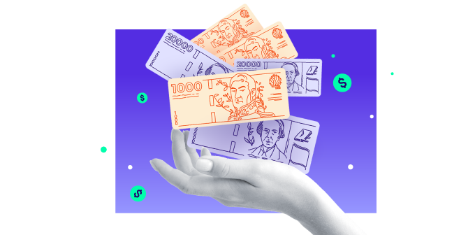 Mano sosteniendo billetes de iol