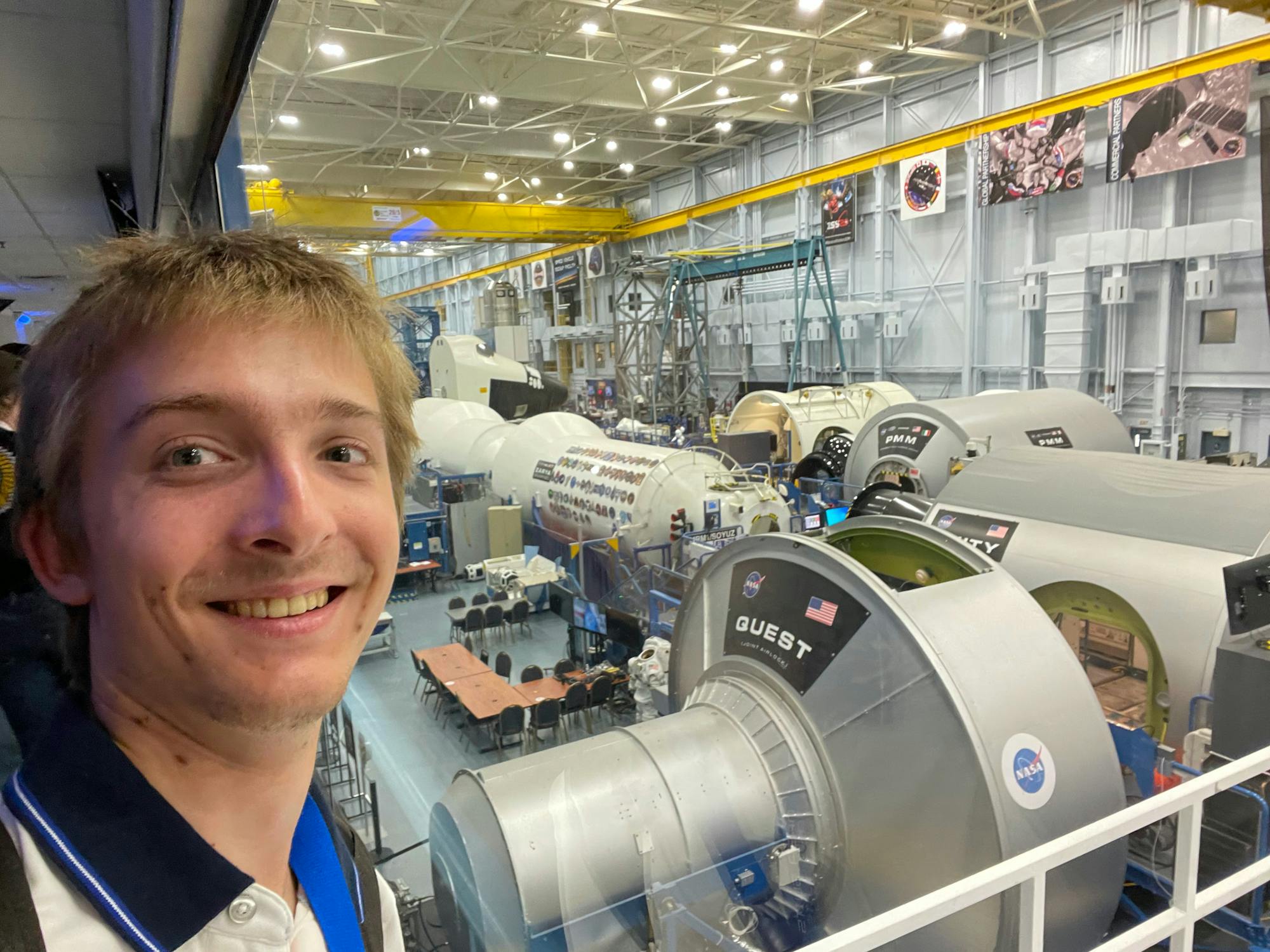 Selfie of a young man posing in front of decommissioned space modules