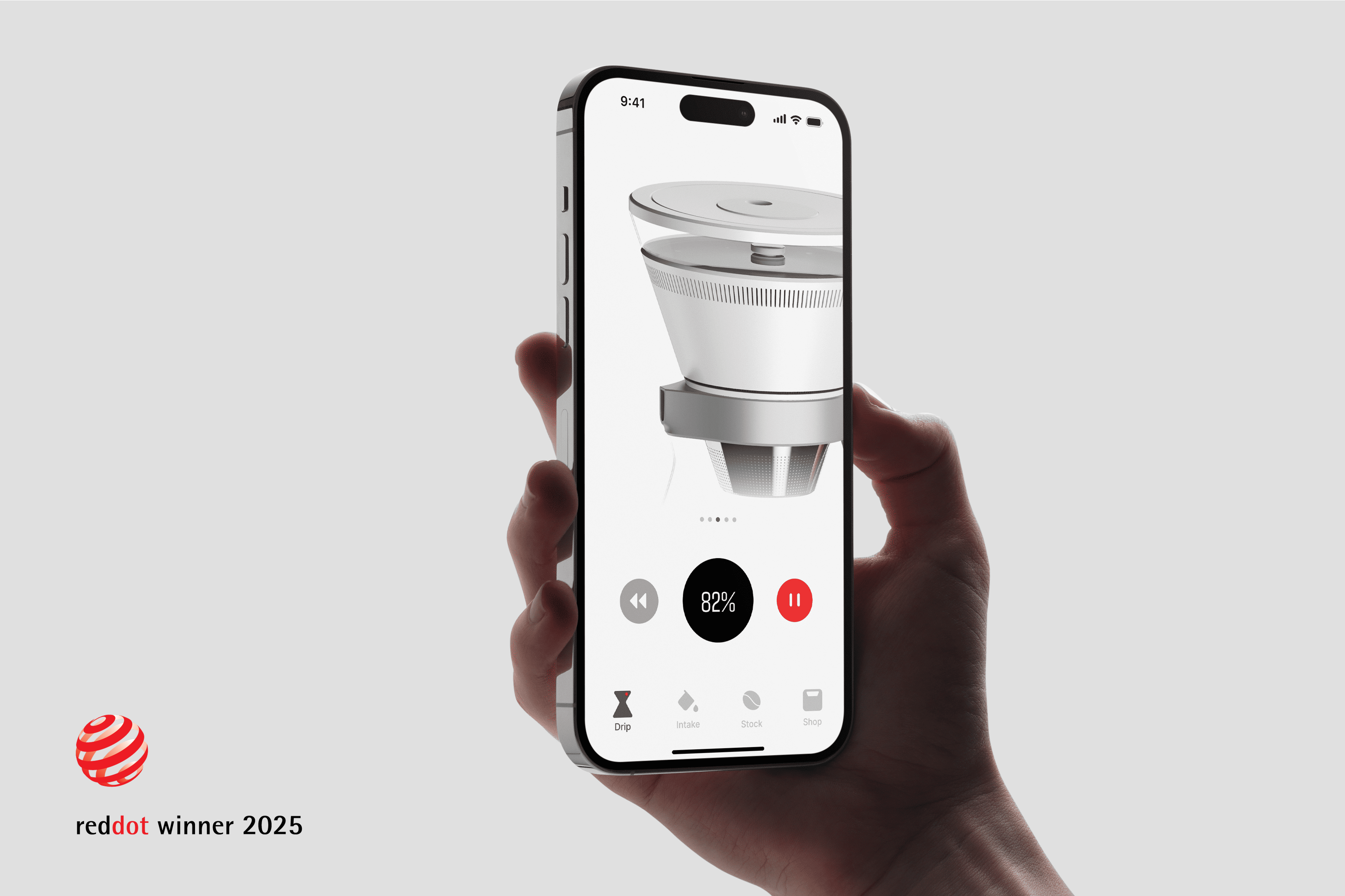 Hand holding a smart phone which shows the image of a conical coffee dripper. 