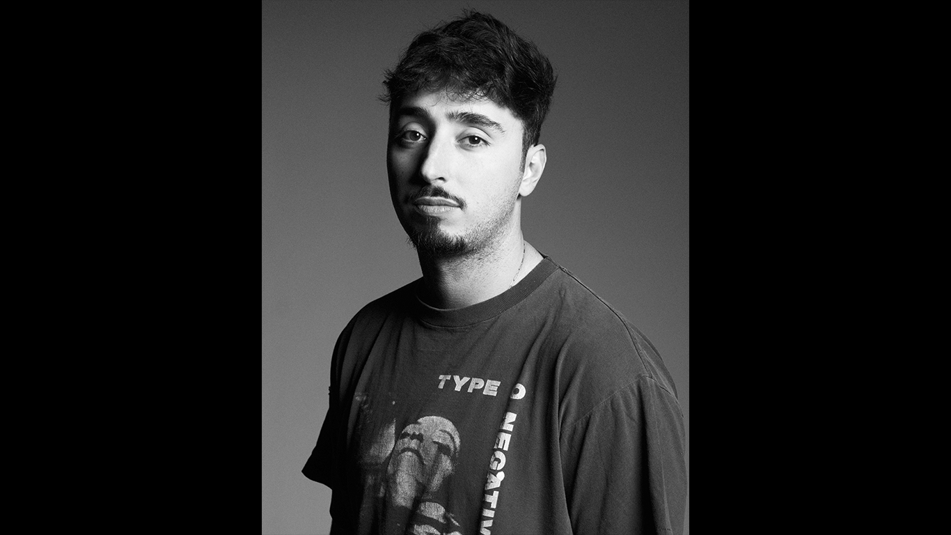 Moody, black and white photo of Zack Bia. 