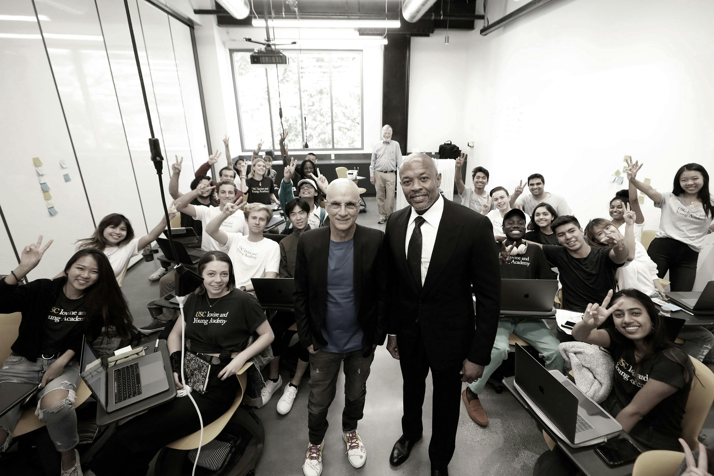 The Founders Jimmy Iovine and Andre “Dr. Dre” Young take a photo with a group of students