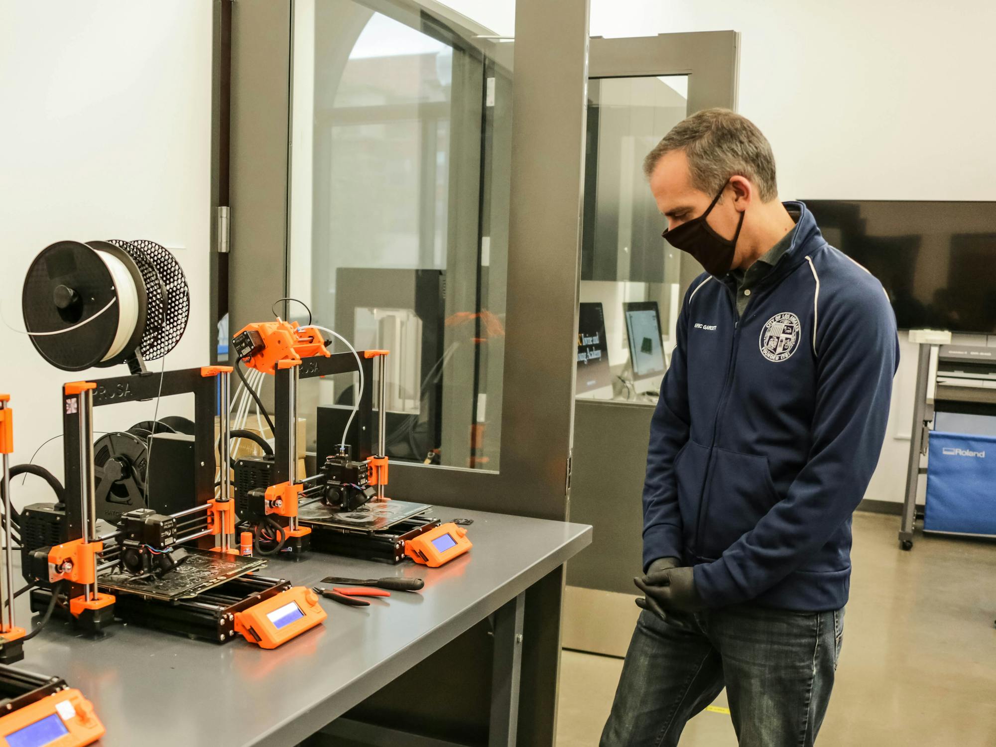 Mayor of Los Angeles, Eric Garcetti, looking at 3D printers