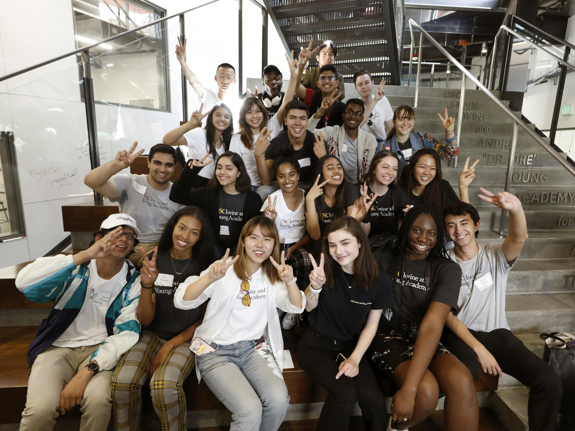 Group of students sitting on steps