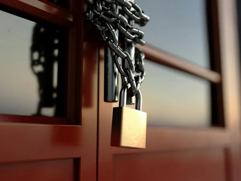 Padlock and Chain On Door