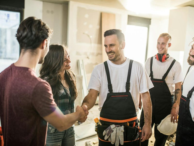 Customers greeting tradesmen