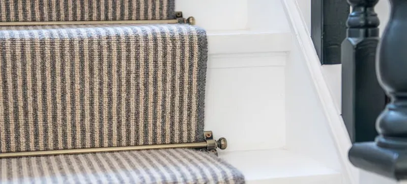 An image of gold stair rods