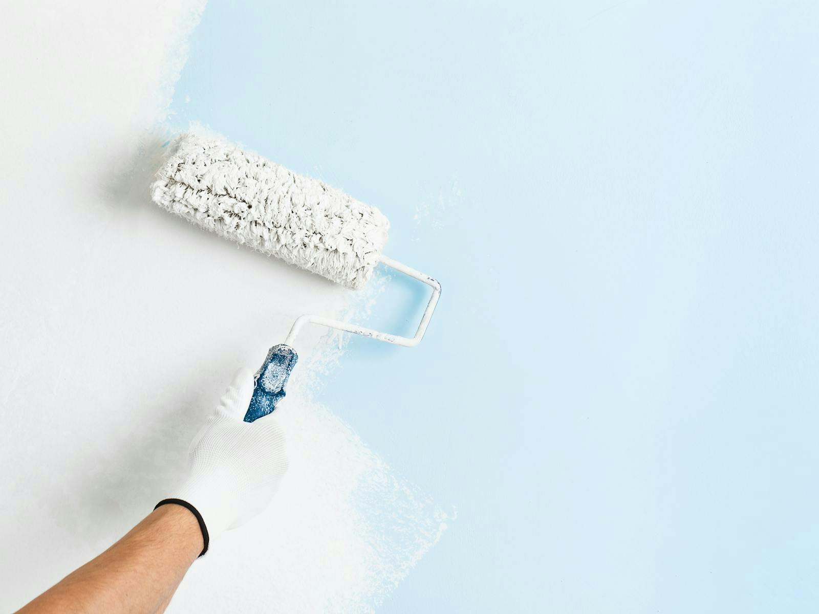 Painting a wall with a roller