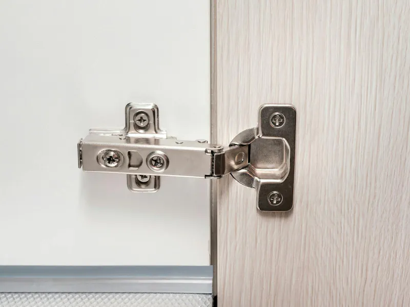 An image of a cabinet hinge