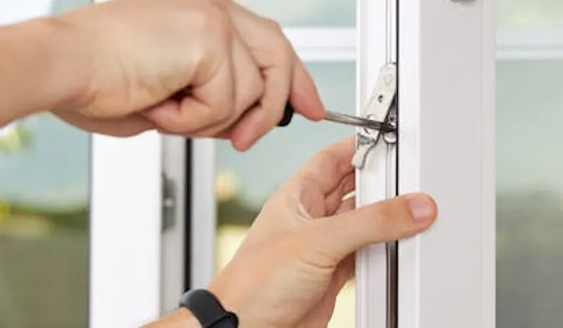Person securing a uPVC window
