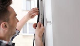 An image of an intumescent strip being fitted