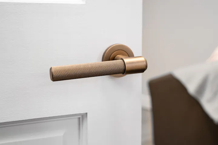 An image of a door handle on a door