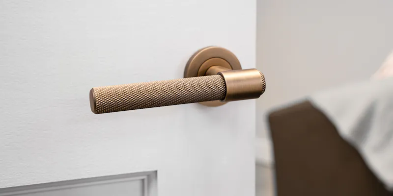 An image of a door handle on a door