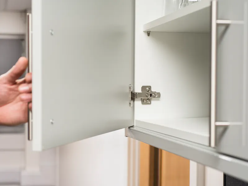 An image of kitchen hinges